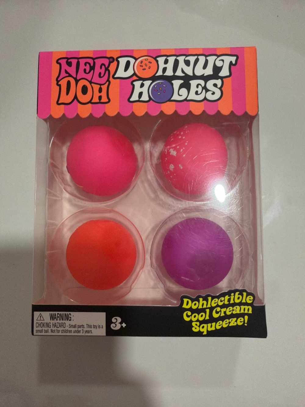 NeeDoh Dohnut Holes 4 pack! Pink sprinkles/purple/orange